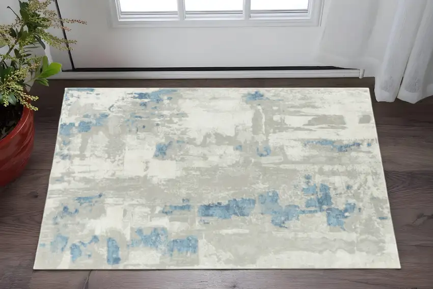 Ivory Gray And Blue Abstract Stain Resistant Area Rug Photo 1