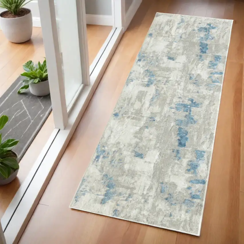 2' X 6' Ivory Gray And Blue Abstract Stain Resistant Area Rug Photo 1