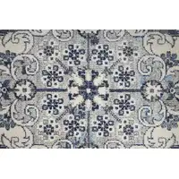 Photo of Ivory Gray And Blue Floral Power Loom Distressed Stain Resistant Area Rug