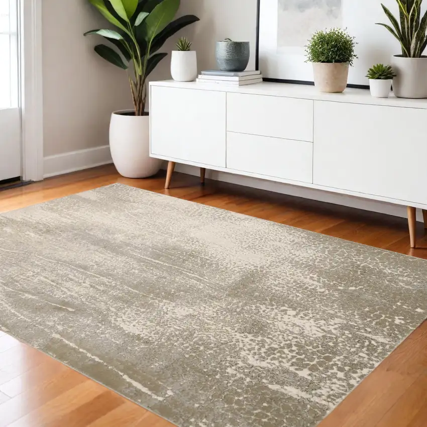 Gold Gray And Ivory Abstract Area Rug Photo 1