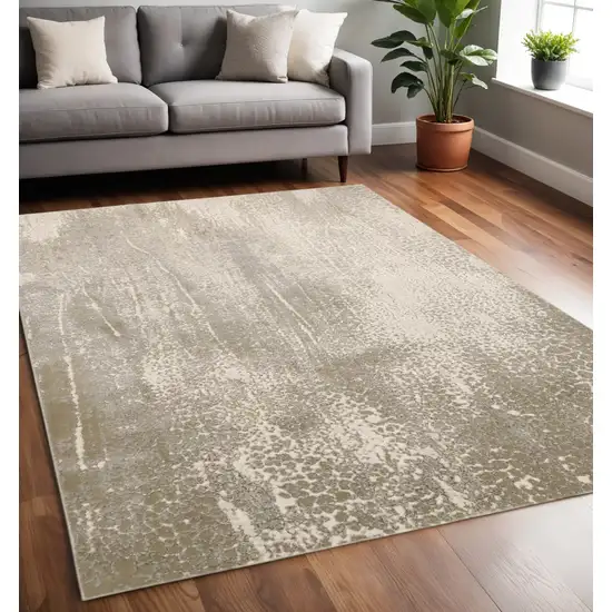 Gold Gray And Ivory Abstract Area Rug Photo 1