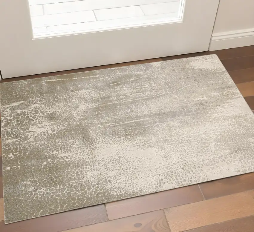 Gold Gray And Ivory Abstract Area Rug Photo 1