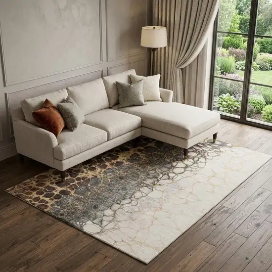Ivory Gray And Gold Abstract Distressed Washable Area Rug With UV Protection Photo 1