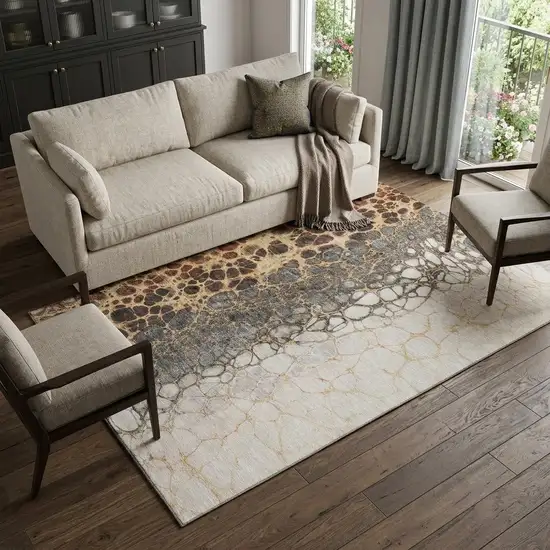Ivory Gray And Gold Abstract Distressed Washable Area Rug With UV Protection Photo 1