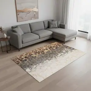 Photo of Ivory Gray And Gold Abstract Washable Area Rug With UV Protection