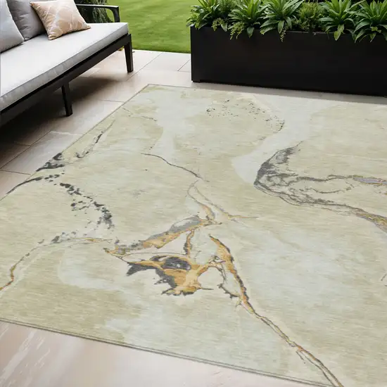Ivory Gray And Gold Abstract Washable Indoor Outdoor Area Rug Photo 1