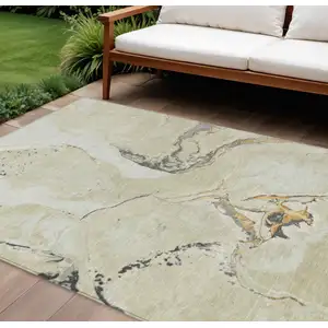 Photo of Ivory Gray And Gold Abstract Washable Indoor Outdoor Area Rug