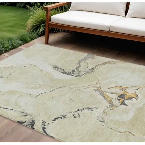 Ivory Gray And Gold Abstract Washable Indoor Outdoor Area Rug Photo 1