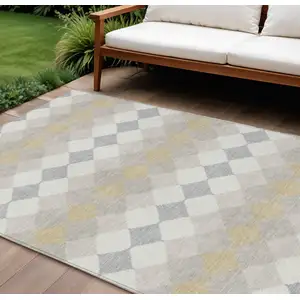 Photo of Ivory Gray And Gold Geometric Washable Indoor Outdoor Area Rug