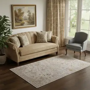 Photo of Ivory Gray And Gold Oriental Area Rug With Fringe