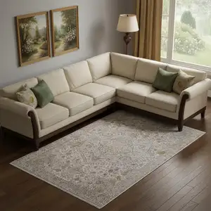 Photo of Ivory Gray And Gold Oriental Area Rug With Fringe