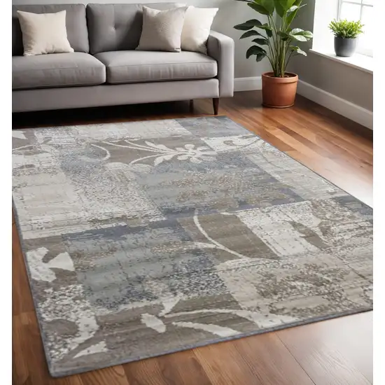Gray And Ivory Floral Distressed Area Rug Photo 1