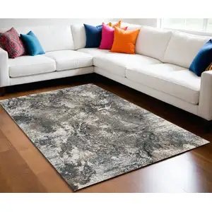 Photo of Ivory Gray And Orange Abstract Area Rug