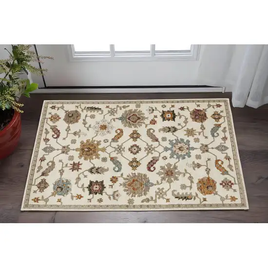Ivory Gray And Orange Oriental Area Rug Photo 1