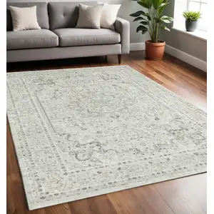 Photo of Ivory Gray And Taupe Floral Power Loom Stain Resistant Area Rug