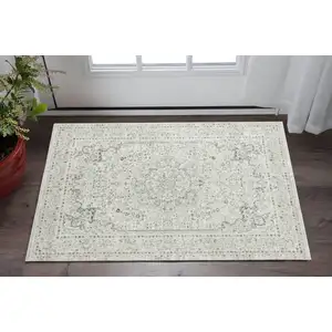 Photo of Ivory Gray And Taupe Floral Stain Resistant Area Rug