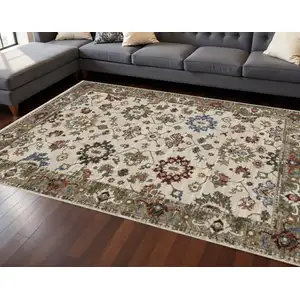 Photo of Ivory Green And Red Oriental Area Rug With Fringe