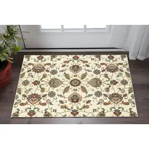Photo of Ivory Green Blue Red Salmon And Yellow Floral Power Loom Stain Resistant Area Rug