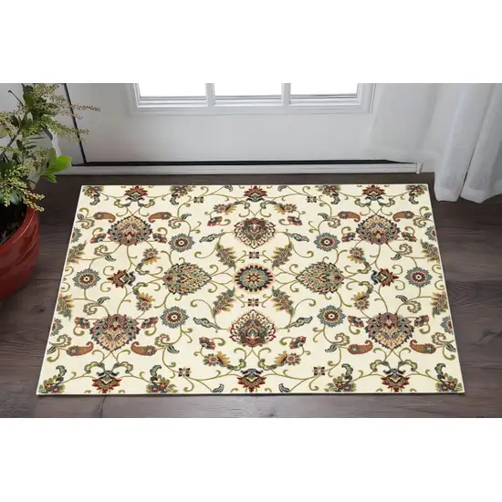 2' X 4' Ivory Green Blue Red Salmon And Yellow Floral Power Loom Stain Resistant Area Rug Photo 1
