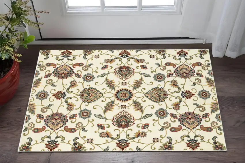 2' X 4' Ivory Green Blue Red Salmon And Yellow Floral Power Loom Stain Resistant Area Rug Photo 1