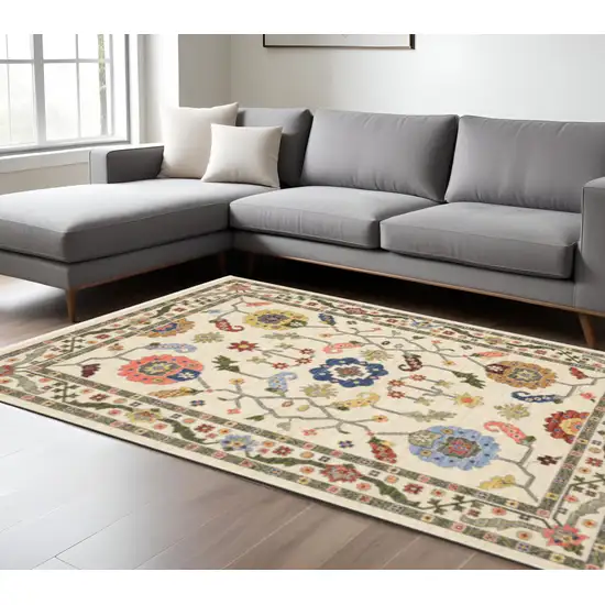 6' X 9' Ivory Green Blues Pink Yellow Rust Brown Tan And Grey Oriental Power Loom Stain Resistant Area Rug With Fringe Photo 1