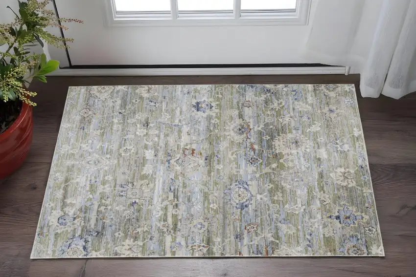 Ivory Green and Blue Floral Power Loom Worn Faded Area Rug Photo 1