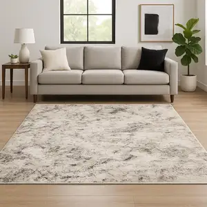 Photo of Ivory Grey Black Beige And Tan Abstract Power Loom Stain Resistant Area Rug