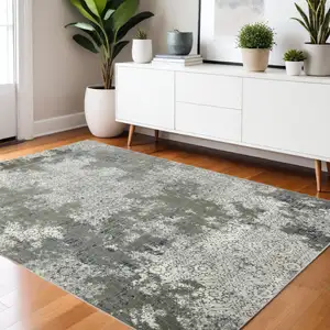 Photo of Ivory Grey Blue And Taupe Abstract Power Loom Stain Resistant Area Rug