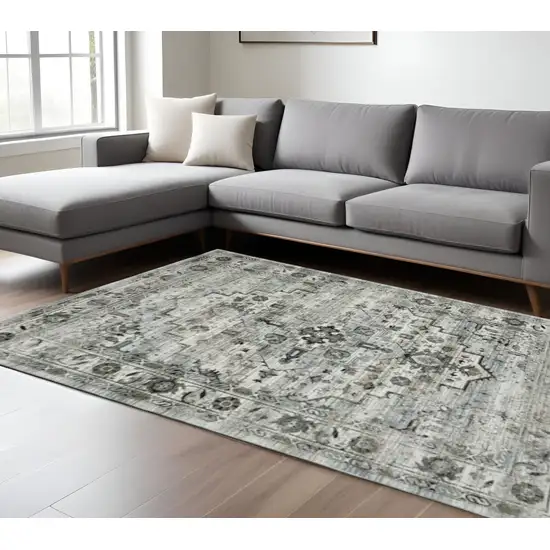 6' X 9' Ivory Grey Charcoal Blue And Taupe Oriental Power Loom Stain Resistant Area Rug Photo 1