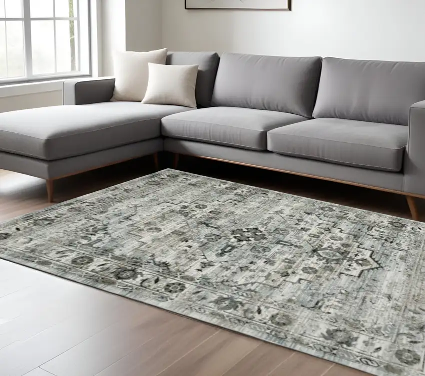 6' X 9' Ivory Grey Charcoal Blue And Taupe Oriental Power Loom Stain Resistant Area Rug Photo 1