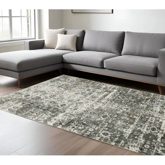 6' X 9' Ivory Grey Charcoal Rust Gold And Brown Oriental Power Loom Stain Resistant Area Rug Photo 1
