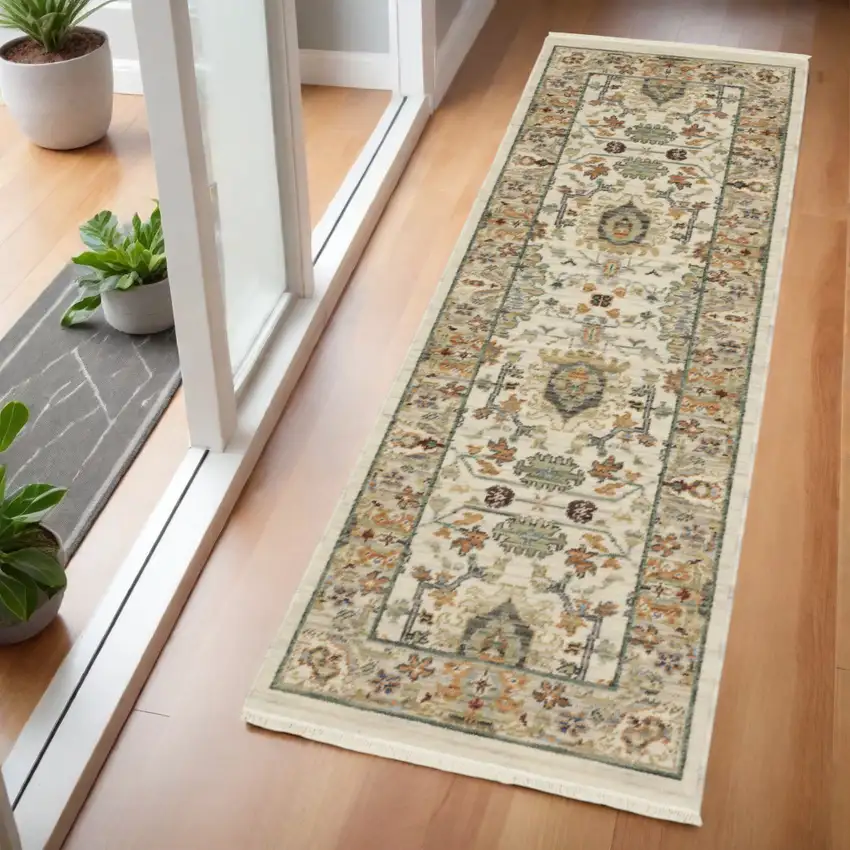 2' X 6' Ivory Grey Orange Green Blue And Red Oriental Power Loom Stain Resistant Runner Rug With Fringe Photo 1