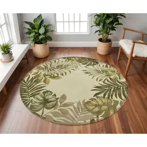 Photo of Ivory Hand Tufted Bordered Tropical Leaves Round Indoor Area Rug