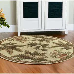Photo of Ivory Hand Tufted Bordered Tropical Plants Round Indoor Area Rug