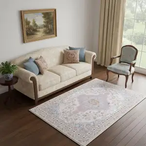 Photo of Ivory Light Blue And Peach Medallion Distressed Washable Area Rug