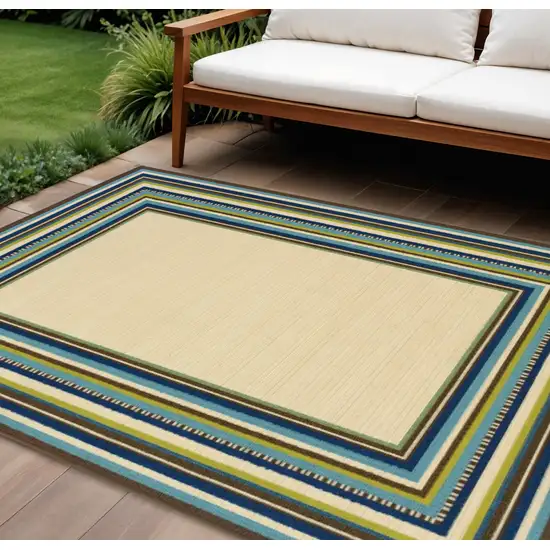 Ivory And Blue Striped Indoor Outdoor Area Rug Photo 1