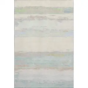 Photo of Ivory Mint Green And Teal Abstract Washable Area Rug With UV Protection