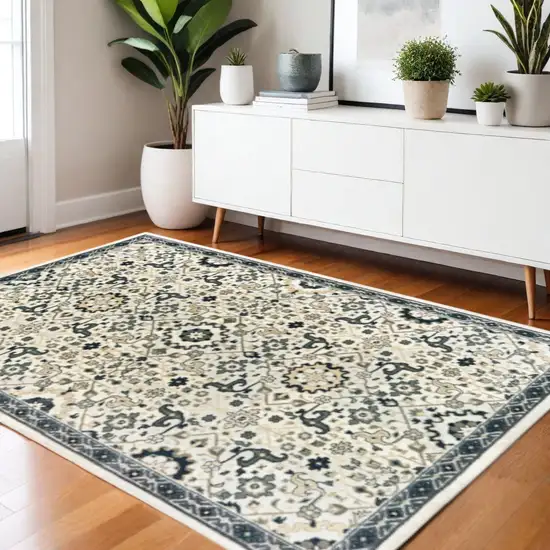 Ivory Navy And Gold Oriental Power Loom Stain Resistant Area Rug Photo 1