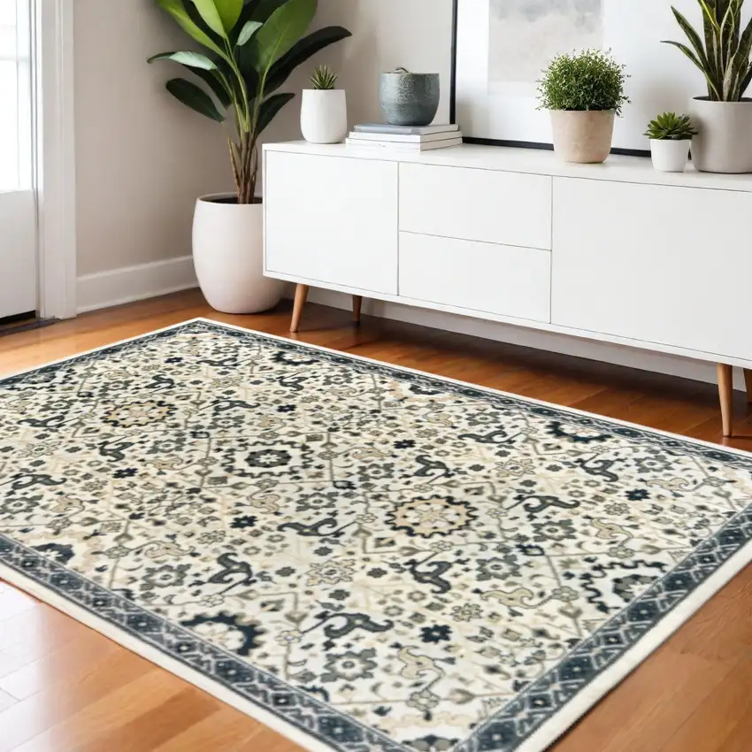 Ivory Navy And Gold Oriental Power Loom Stain Resistant Area Rug Photo 1