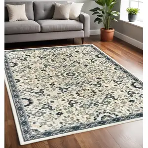 Photo of Ivory Navy And Gold Oriental Power Loom Stain Resistant Area Rug