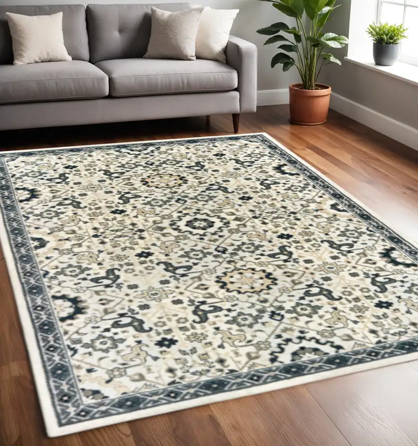 Ivory Navy And Gold Oriental Power Loom Stain Resistant Area Rug Photo 1
