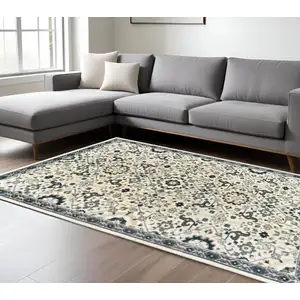 Photo of Ivory Navy And Gold Oriental Power Loom Stain Resistant Area Rug
