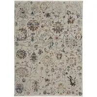 Photo of Ivory Orange And Blue Floral Power Loom Distressed Area Rug With Fringe