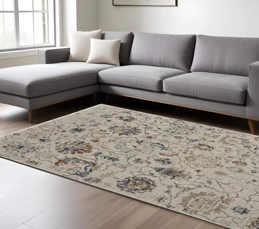 Ivory and Blue Floral Power Loom Distressed Non Skid Area Rug With Fringe Photo 1