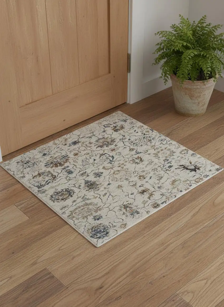 Ivory Blue And Burnt Orange Floral Distressed Area Rug With Fringe Photo 1
