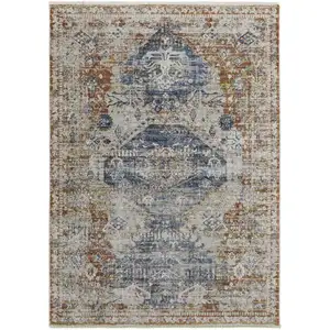 Photo of Ivory Orange And Blue Floral Power Loom Distressed Area Rug With Fringe