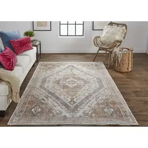 Photo of Ivory Orange And Brown Abstract Area Rug