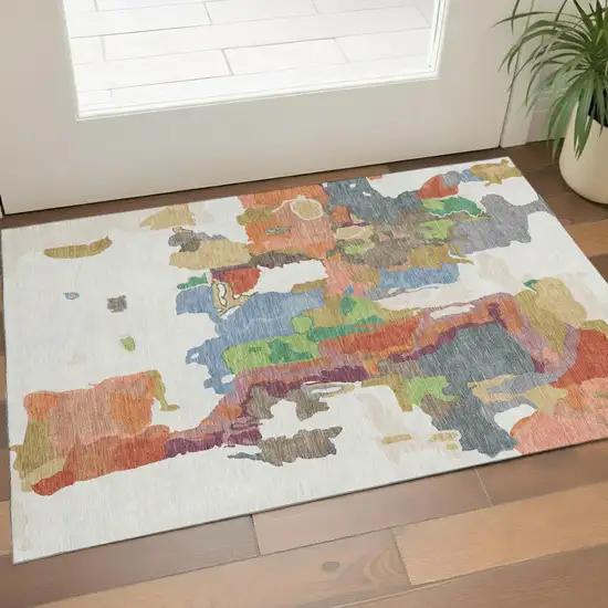 Ivory Orange Blue And Green Abstract Washable Area Rug With UV Protection Photo 1