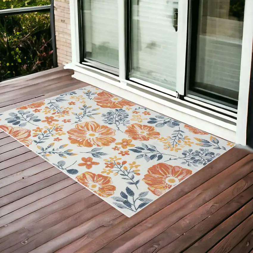 Ivory Orange and Blue Floral Stain Resistant Indoor Outdoor Area Rug Photo 1