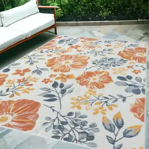 Photo of Ivory Orange and Blue Floral Stain Resistant Indoor Outdoor Area Rug